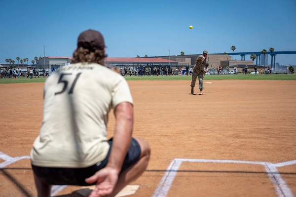 Sailors assigned to Naval Special Warfare units play a softball game against former San Diego Padres baseball players at Naval Amphibious Base Coronado.