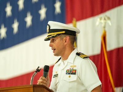 IMAGE: Outgoing Naval Surface Warfare Center Dahlgren Division Dam Neck Activity Commanding Officer Cmdr. Matthew Erdner delivers his remarks during the change of command ceremony June 29, at Naval Air Station Oceana in Virginia Beach.