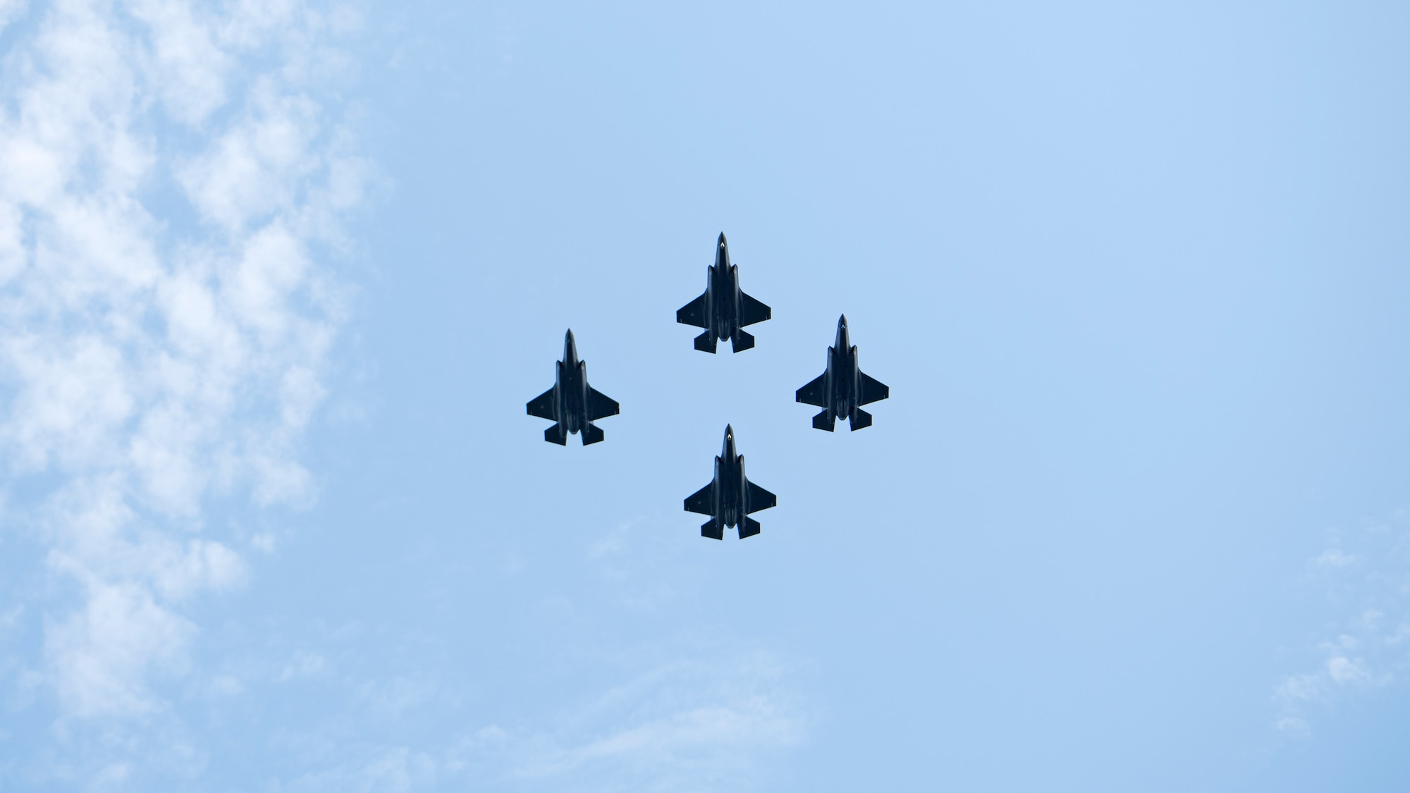 Four Royal Netherlands Air Force F-35A Lightning II aircraft fly above a change of command ceremony at Volkel Air Base, Netherlands, June 30, 2022. U.S. Airmen participated in a parade welcoming the first F-35s to Volkel AB as well as commemorating the newly established Air Combat Command.