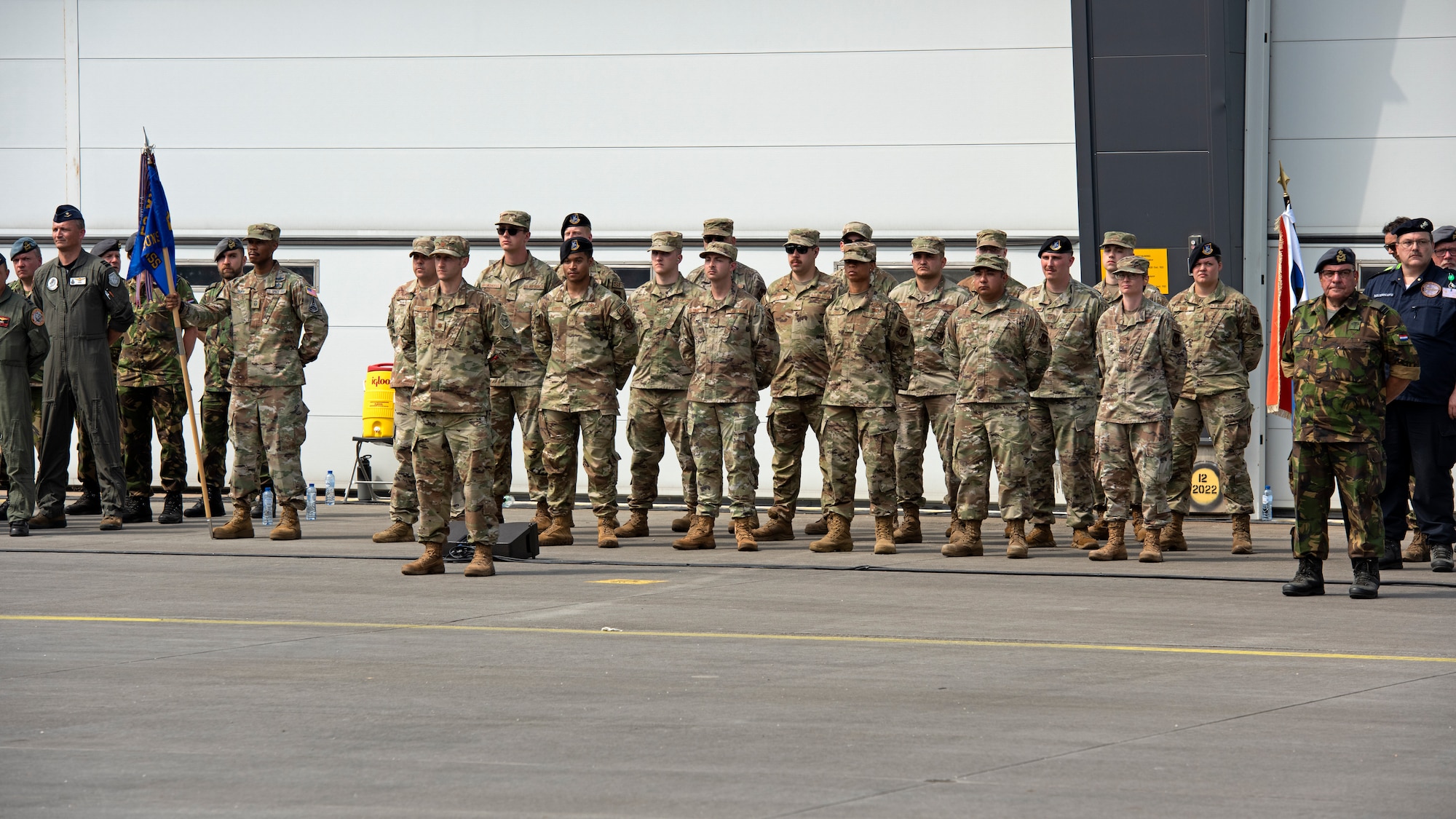 U.S. Airmen participate in a change of command ceremony with members of the Royal Netherlands air force on Volkel Air Base, Netherlands, June 30, 2022. U.S. forces in Europe live, train, and operate with allies and partners from strategic locations across Europe that are critical for continued collaboration and NATO partnerships.