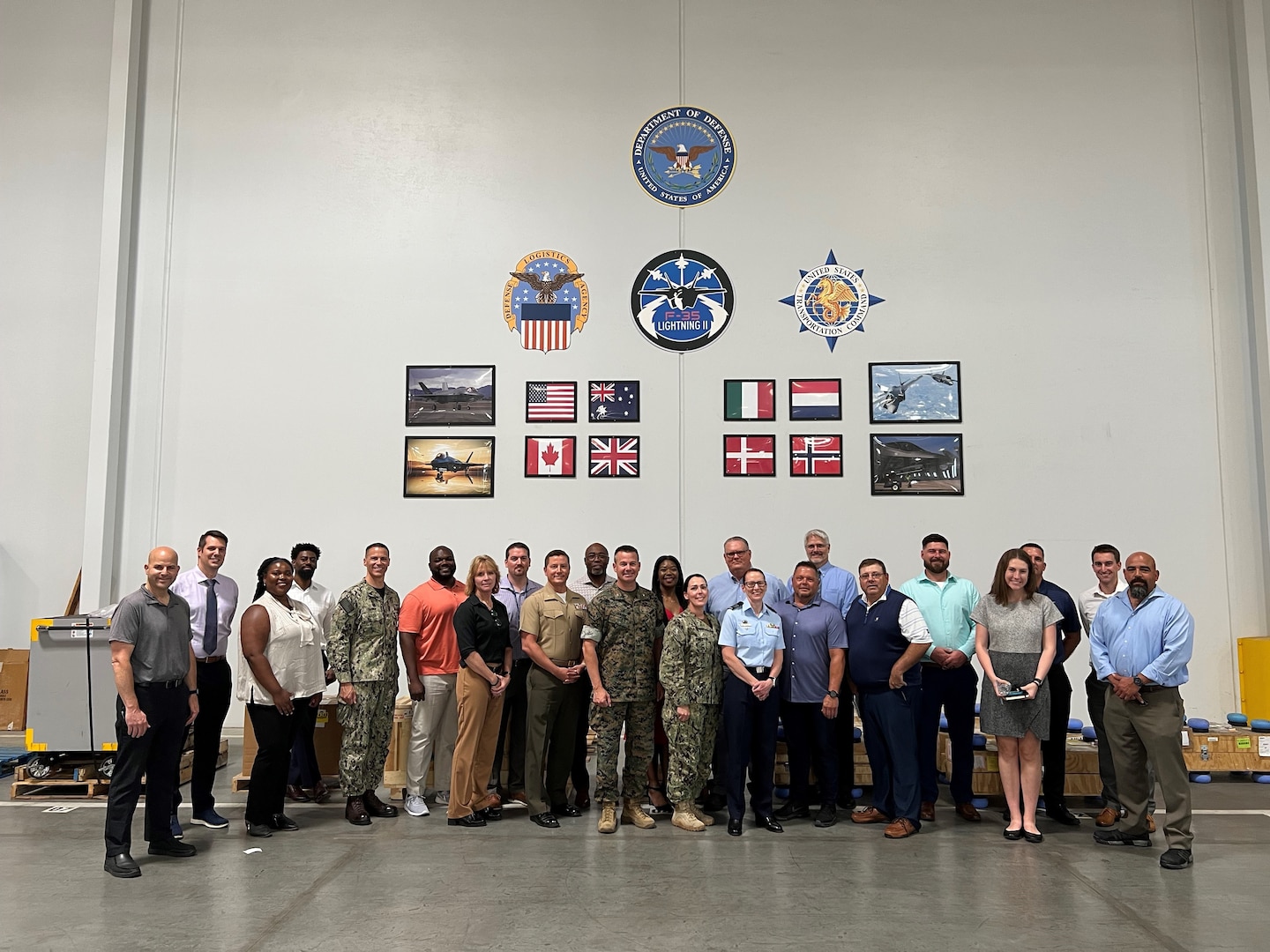 Group photo of military and civilian personnel.