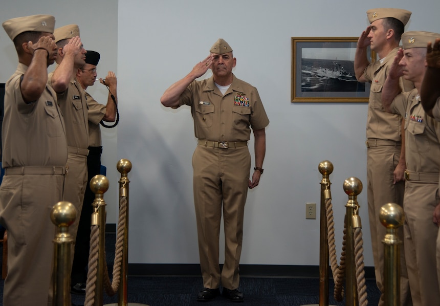 Chief of Chaplains of the Navy Rear Adm. Gregory Todd, salutes before passing through sideboys during the Naval Chaplaincy School (NCS) assumption of command ceremony at Naval Station Newport, June 30, 2022.