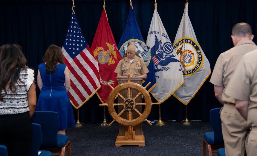 Chief of Chaplains of the Navy Rear Adm. Gregory Todd delivers the invocation during the Naval Chaplaincy School (NCS) assumption of command ceremony at Naval Station Newport, June 30, 2022.