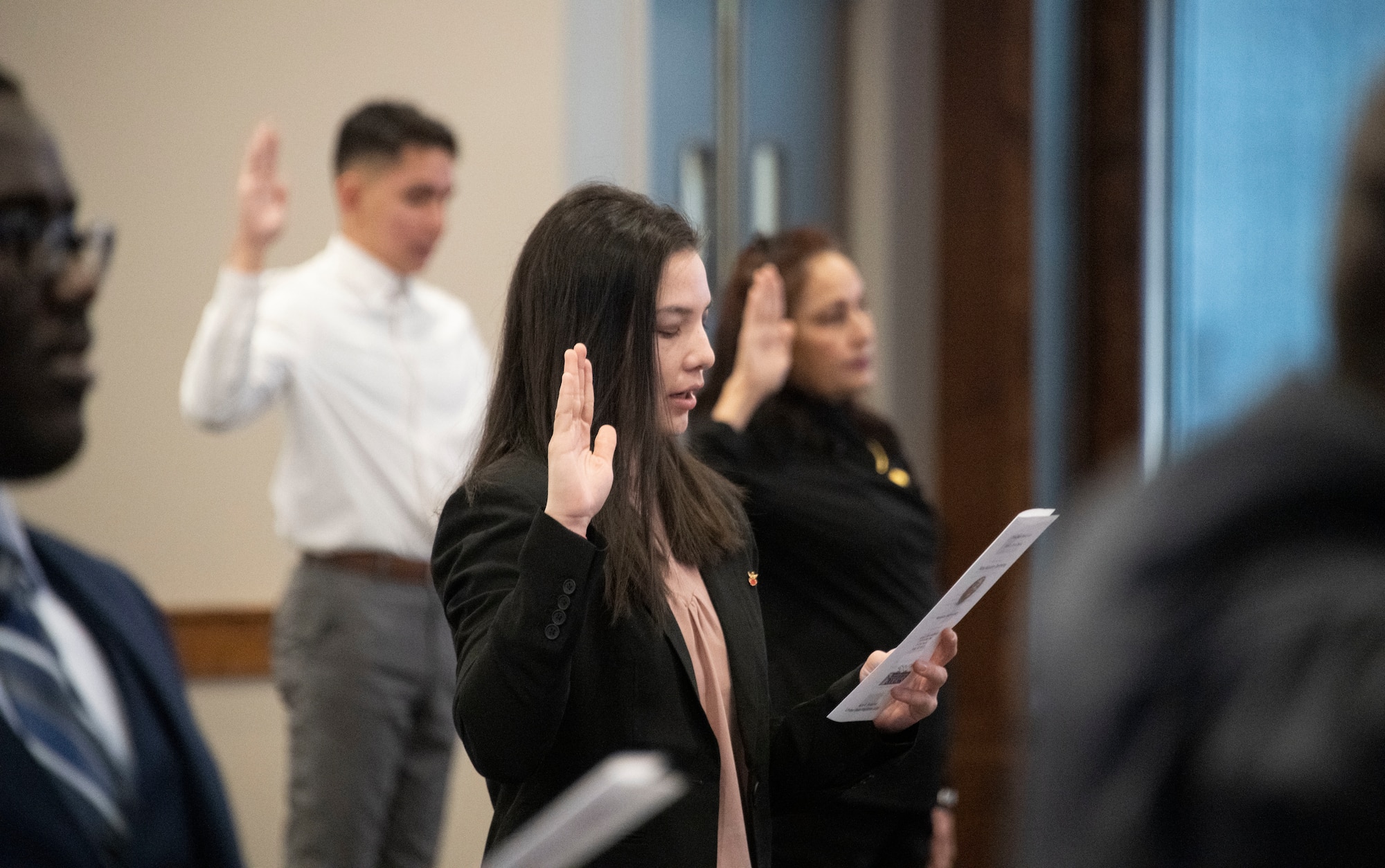 Airman 1st Class Lian Espinoza Fuentes, 319th Force Support Squadron food services journeyman, swears the Oath of Allegiance to the United States of America during a naturalization ceremony in Fargo, North Dakota, March 9, 2022. Espinoza Fuentes, originally from Chiriquí Province, Panama, now works in the Services career field, which provides food, lodging, fitness and readiness support for Airmen and families. (U.S. Air Force photo by Senior Airman Dakota C. LeGrand)