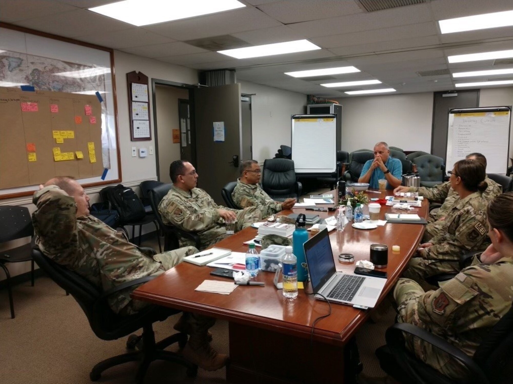 AGRs and ARTs sit around conference table, discussing ways to make the 624 Regional Support Group even better for its members.