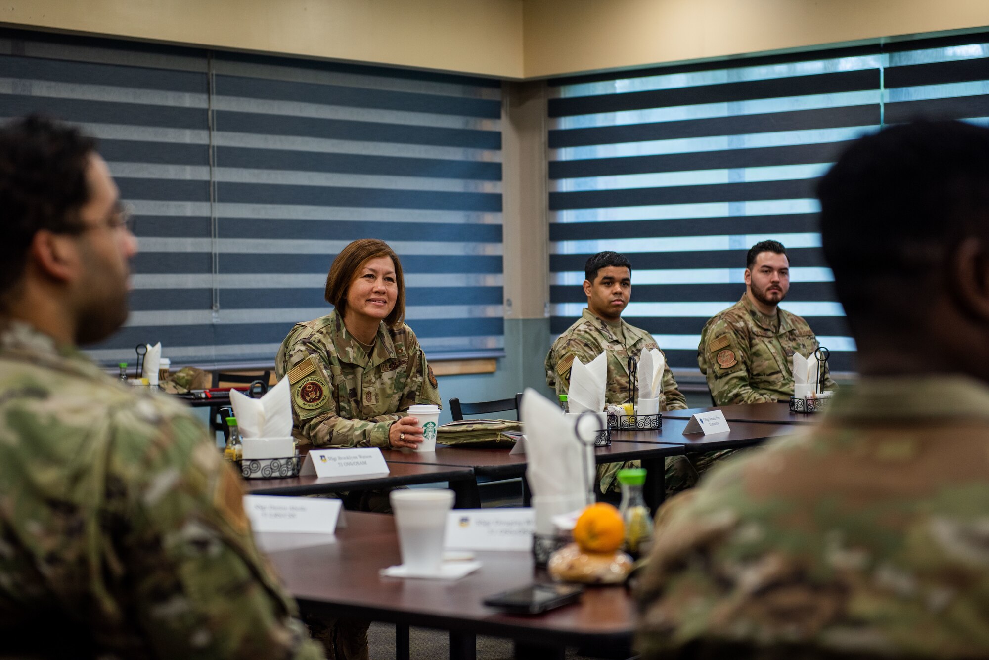 Chief Master Sgt. of the Air Force JoAnne S. Bass listens to an Airman’s feedback during an Airmen’s Breakfast on her tour at Osan Air Base, Republic of Korea, June 28, 2022.