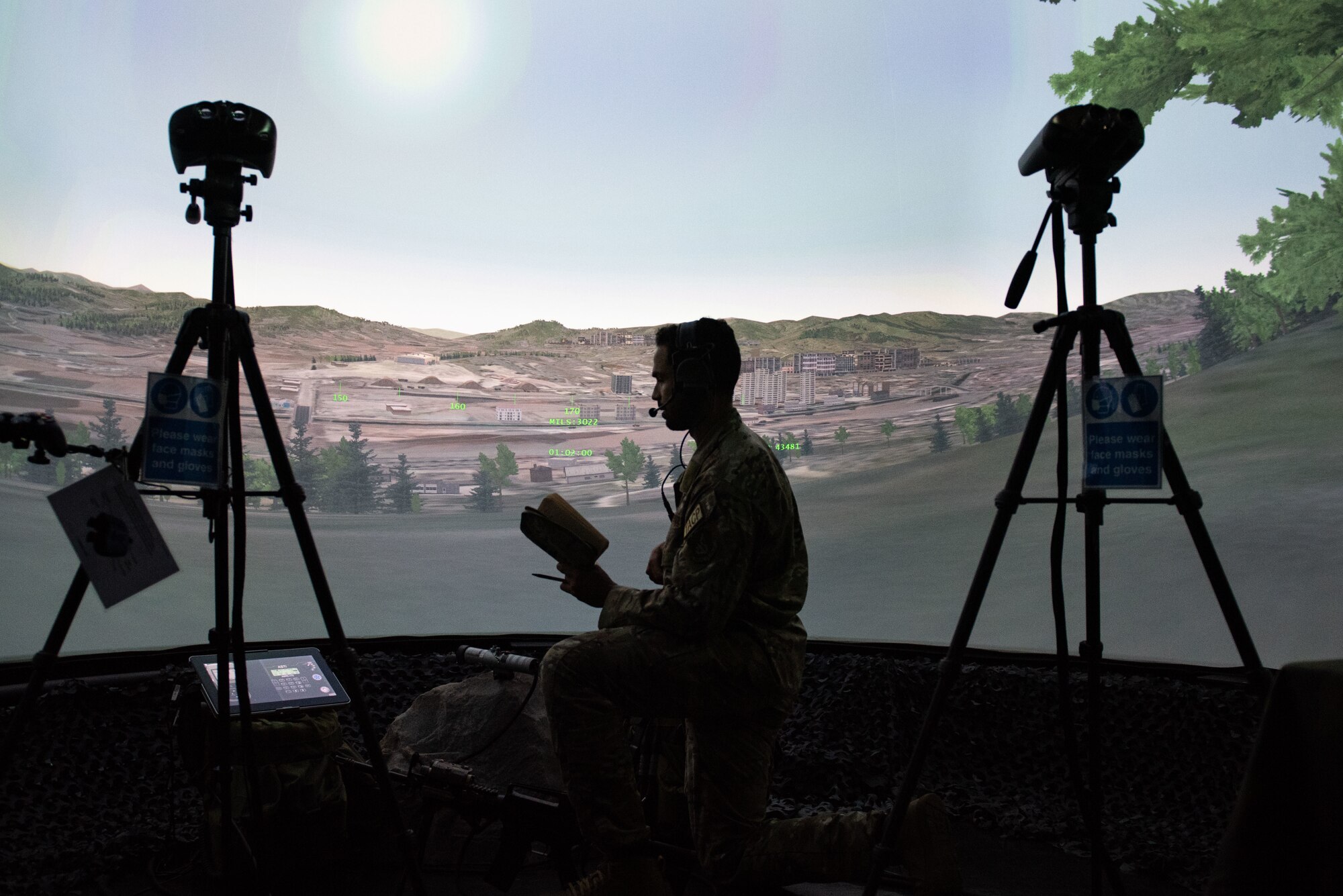Staff Sgt. Joshua Nunez, 607th Air Support Operations Group tactical air control party member, demonstrates the procedures TACP’s execute while training in a Joint Terminal Controller Training Rehearsal System as part of Chief Master Sgt. of the Air Force JoAnne S. Bass’ three-day tour at Osan Air Base, Republic of Korea, June 30, 2022.