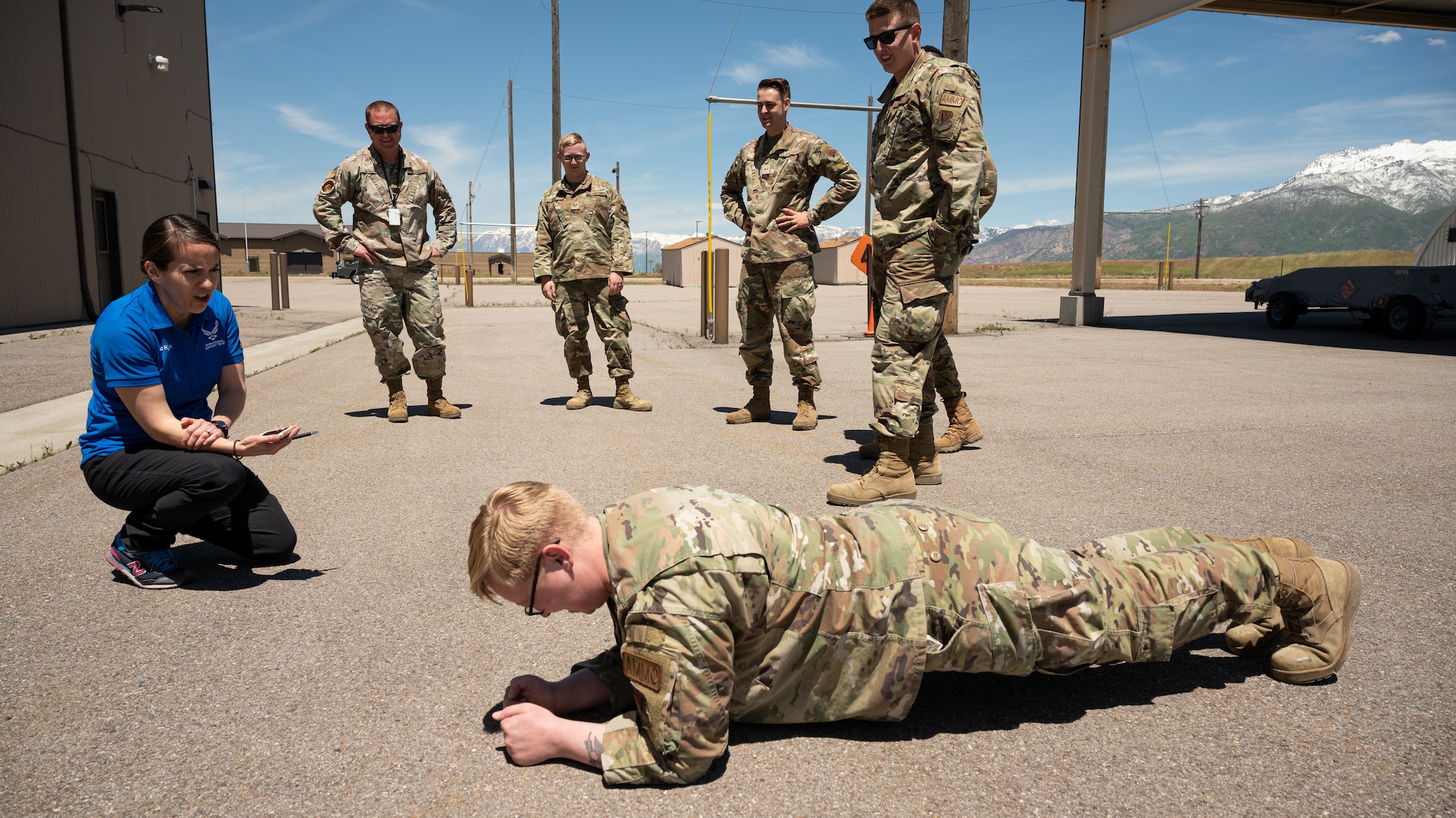 Lt. Col. Ember Ryals, 75th Medical Group Operation Support Team flight commander, administers a time core strength assessment at Hill Air Force Base, Utah,