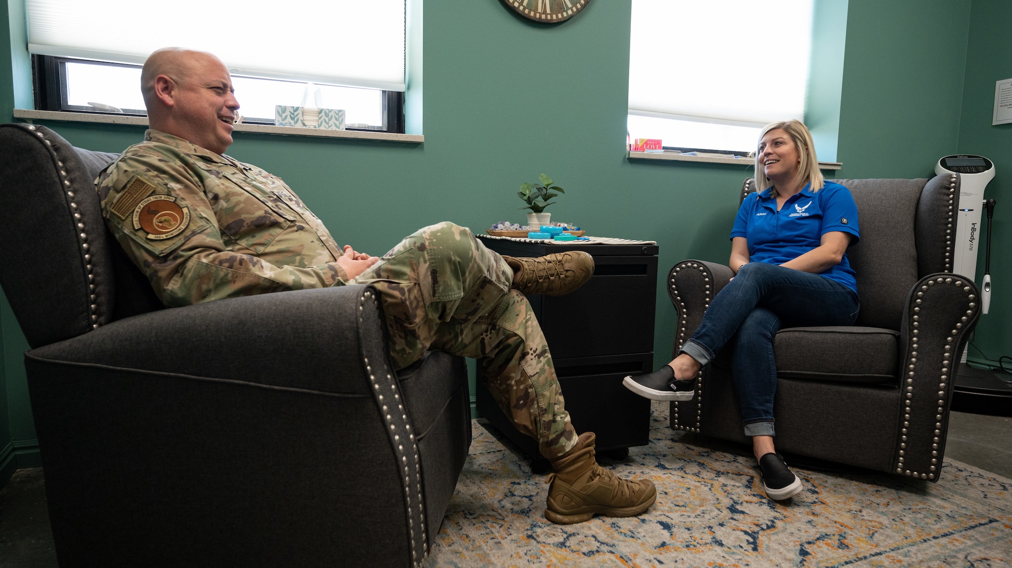 Alisha Delacruz, 75th Medical Group Operation Support Team, speaks with Master Sgt. Simon McCabe, 388th Munitions Squadron first sergeant at Hill Air Force Base.