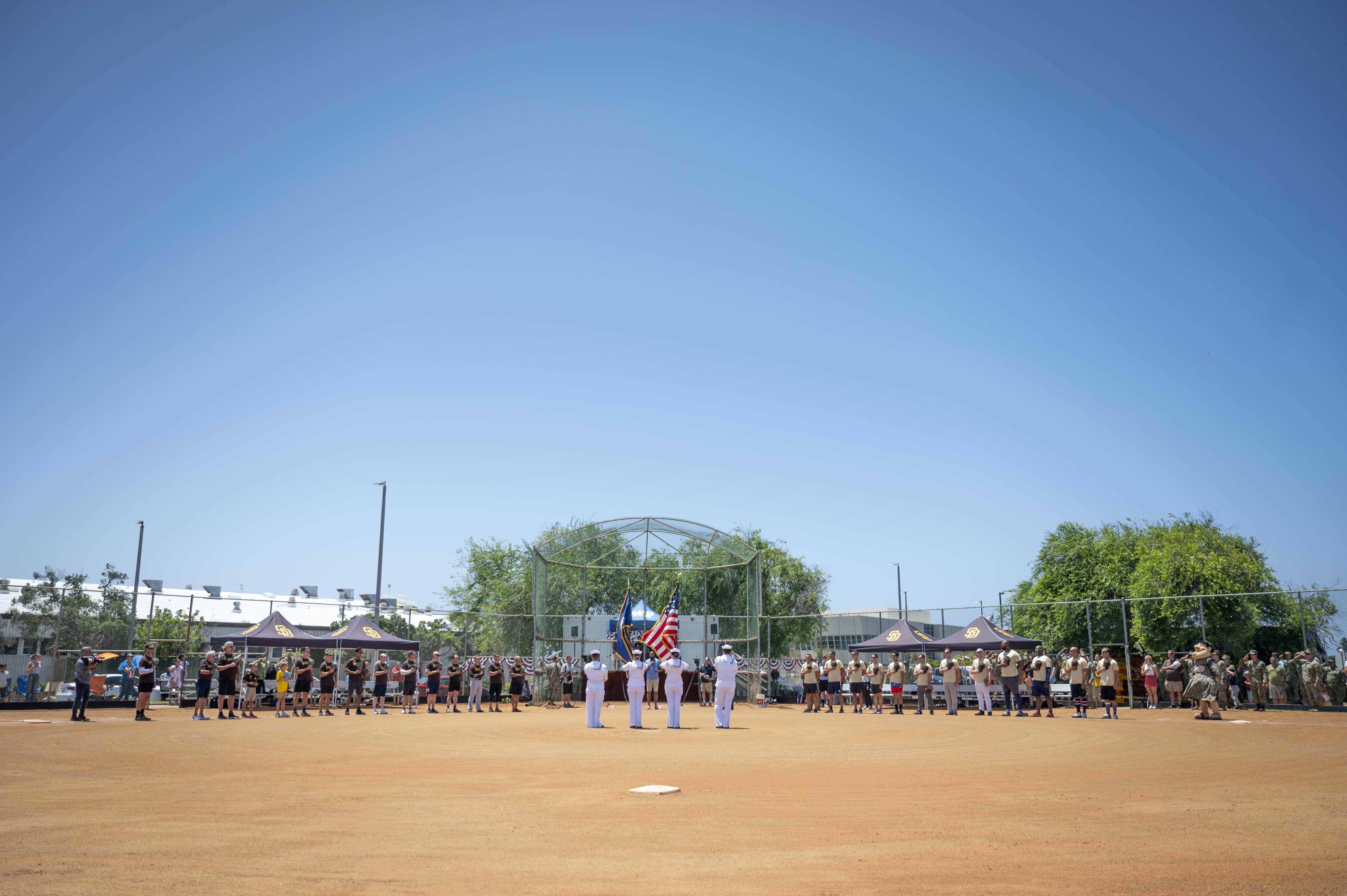 Sailors assigned to Naval Special Warfare units play a softball game against former San Diego Padres baseball players at Naval Amphibious Base Coronado.