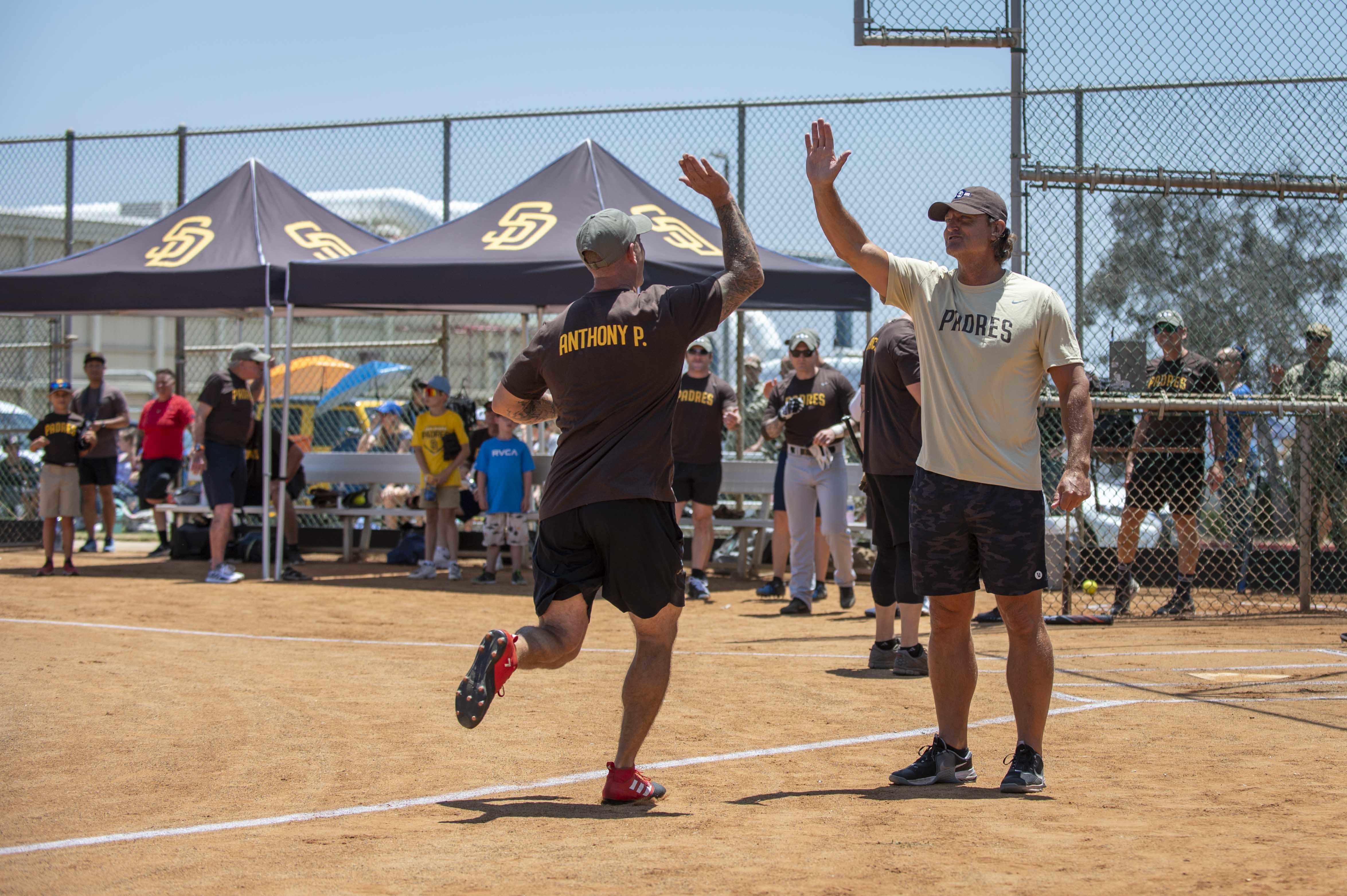 Sailors assigned to Naval Special Warfare units play a softball game against former San Diego Padres baseball players at Naval Amphibious Base Coronado.