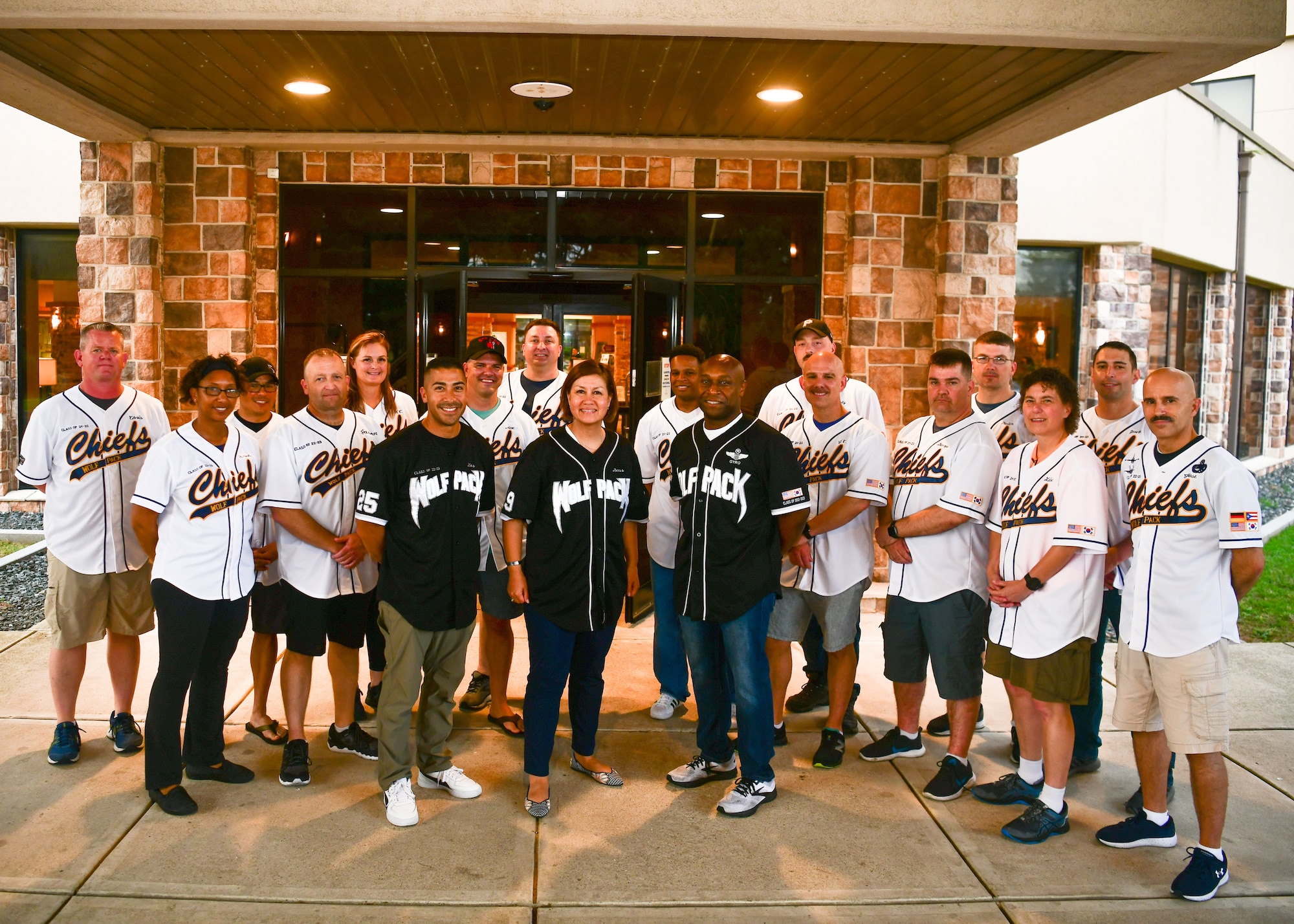 Chief Master Sgt. of the Air Force JoAnne S. Bass, center, takes a group photo with Wolf Pack leaders, at Kunsan Air Base, Republic of Korea, June 26, 2022. During her visit, Bass met with Airmen, Wing leaders, and recognized service members for their outstanding achievement. (U.S. Air Force photo by Staff Sgt. Isaiah J. Soliz)