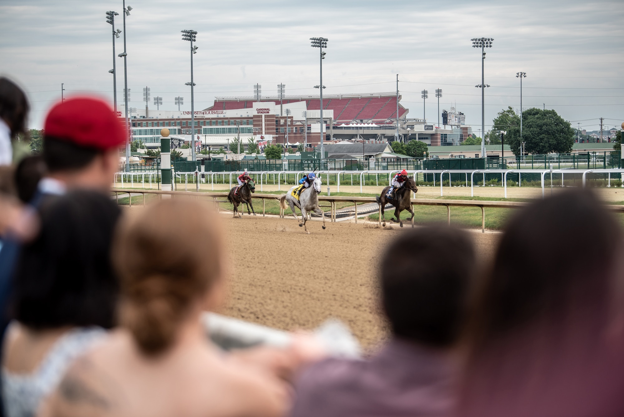 More than 150 Airmen, friends and family members attend Military Appreciation Day at Churchill Downs in Louisville, Ky., June 12, 2022, to honor Tech. Sgt. Travis Brown, a pararescueman from the Kentucky Air National Guard’s 123rd Special Tactics Squadron who died Feb. 16. One of the races on the day's card was named in honor of Brown and concluded with eight of his fellow 123rd STS Airmen presenting the trophy. (U.S. Air National Guard photo by Tech. Sgt. Joshua Horton)