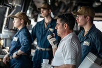 A Croatian tugboat pilot communicates with his team from the pilot house aboard the San Antonio-class amphibious transport dock ship USS Arlington (LPD 24) as the ship arrives in Rijeka, Croatia for mid-deployment voyage repairs, July 4, 2022. Arlington is part of the Kearsarge Amphibious Ready Group and embarked 22nd Marine Expeditionary Unit, under the command and control of Task Force 61/2, on a scheduled deployment in the U.S. Naval Forces Europe area of operations, employed by U.S. Sixth Fleet, to defend U.S., allied and partner interests.