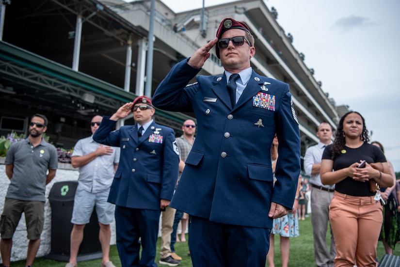 More than 150 Airmen, friends and family members attend Military Appreciation Day at Churchill Downs in Louisville, Ky., June 12, 2022, to honor Tech. Sgt. Travis Brown, a pararescueman from the Kentucky Air National Guard’s 123rd Special Tactics Squadron who died Feb. 16. One of the races on the day's card was named in honor of Brown and concluded with eight of his fellow 123rd STS Airmen presenting the trophy. (U.S. Air National Guard photo by Tech. Sgt. Joshua Horton)