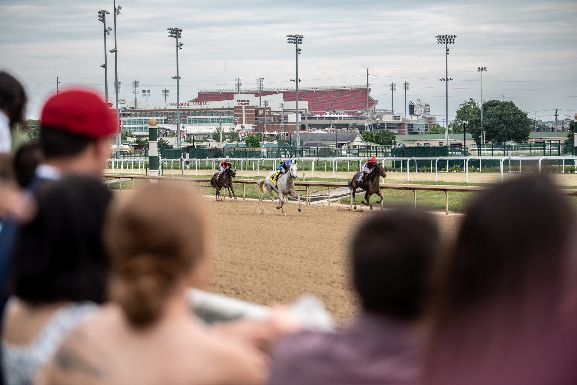 More than 150 Airmen, friends and family members attend Military Appreciation Day at Churchill Downs in Louisville, Ky., June 12, 2022, to honor Tech. Sgt. Travis Brown, a pararescueman from the Kentucky Air National Guard’s 123rd Special Tactics Squadron who died Feb. 16. One of the races on the day's card was named in honor of Brown and concluded with eight of his fellow 123rd STS Airmen presenting the trophy. (U.S. Air National Guard photo by Tech. Sgt. Joshua Horton)