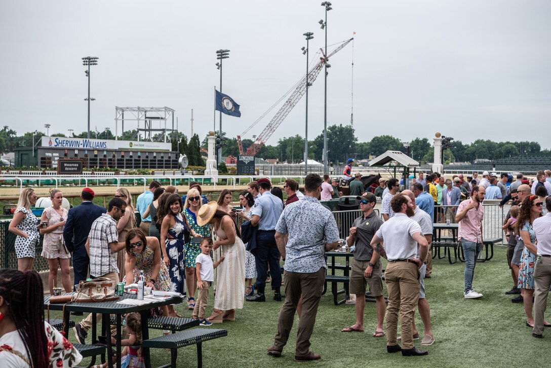 More than 150 Airmen, friends and family members attend Military Appreciation Day at Churchill Downs in Louisville, Ky., June 12, 2022, to honor Tech. Sgt. Travis Brown, a pararescueman from the Kentucky Air National Guard’s 123rd Special Tactics Squadron who died Feb. 16. One of the races on the day's card was named in honor of Brown and concluded with eight of his fellow 123rd STS Airmen presenting the trophy. (U.S. Air National Guard photo by Tech. Sgt. Joshua Horton)