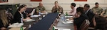 British Royal Air Force Group Capt. Rob O’Dell (left), the director of the Northeast Syria Coordination Group of the Directorate of Civil Environment (DICE), and French Air Force Brig. Gen. Vincent Coste (right), the director of DICE, brief Ambassadorial representatives and aides from multiple Coalition countries about the importance of finding solutions for successfully repatriating individually displaced persons from IDP camps in Iraq and northeast Syria during a meeting June 27, 2022, at Union III forward operating base, in Baghdad, Iraq. The meeting also enabled the DICE team to update the embassy representatives on the current programs and future plans for Combined Joint Task Force – Operation Inherent Resolve’s (CJTF-OIR) advise, assist and enable mission and the Coalition’s role in helping our partners create security and stability in the region. DICE is a directorate of CJTF-OIR. (U.S. Army photo by Sgt. Brian Reed)