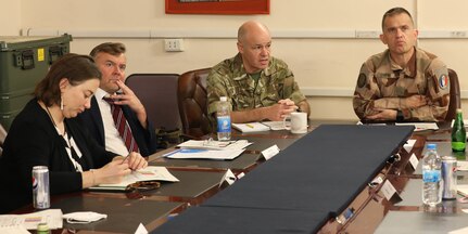 British Royal Air Force Group Capt. Rob O’Dell (left), the director of the Northeast Syria Coordination Group of the Directorate of Civil Environment (DICE), and French Air Force Brig. Gen. Vincent Coste (right), the director of DICE, brief Ambassadorial representatives and aides from multiple Coalition countries about the importance of finding solutions for successfully repatriating individually displaced persons from IDP camps in Iraq and northeast Syria during a meeting June 27, 2022, at Union III forward operating base, in Baghdad, Iraq. The meeting also enabled the DICE team to update the embassy representatives on the current programs and future plans for Combined Joint Task Force – Operation Inherent Resolve’s (CJTF-OIR) advise, assist and enable mission and the Coalition’s role in helping our partners create security and stability in the region. DICE is a directorate of CJTF-OIR. (U.S. Army photo by Sgt. Brian Reed)