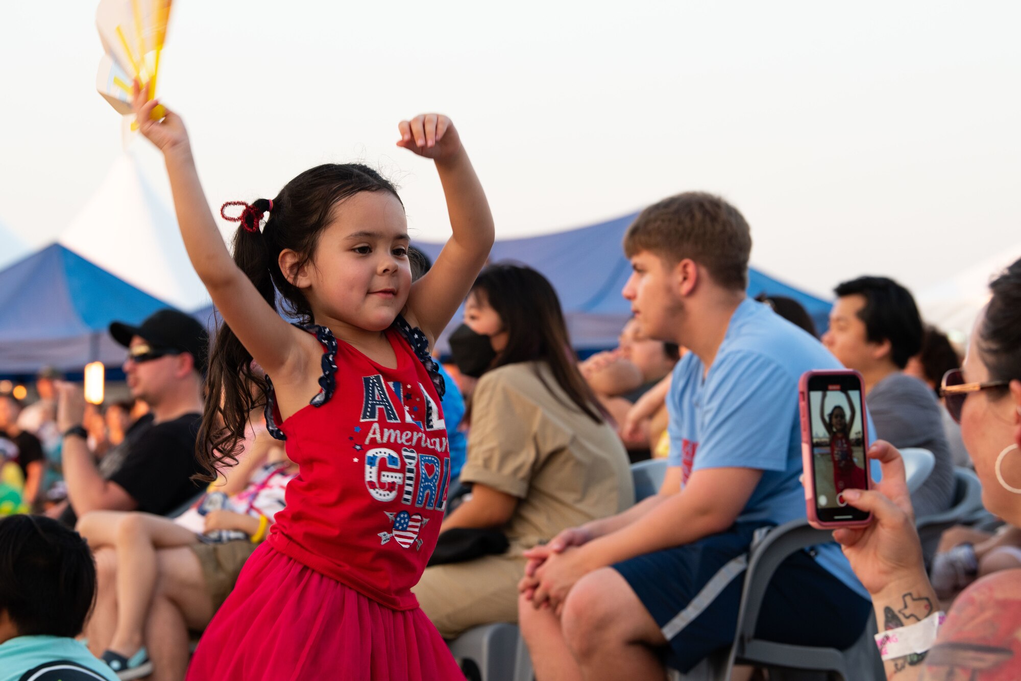 A child dances to music from live performances during Liberty Fest at Osan Air Base, Republic of Korea, July 2, 2022.