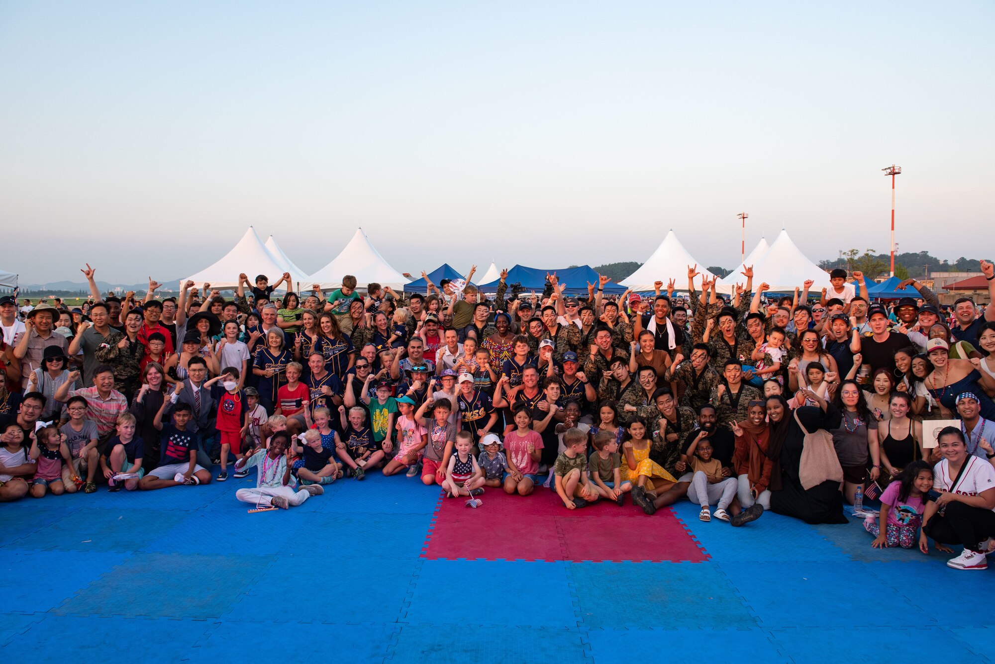 Team Osan gathers for a group photo during Liberty Fest at Osan Air Base, Republic of Korea, July 2, 2022.