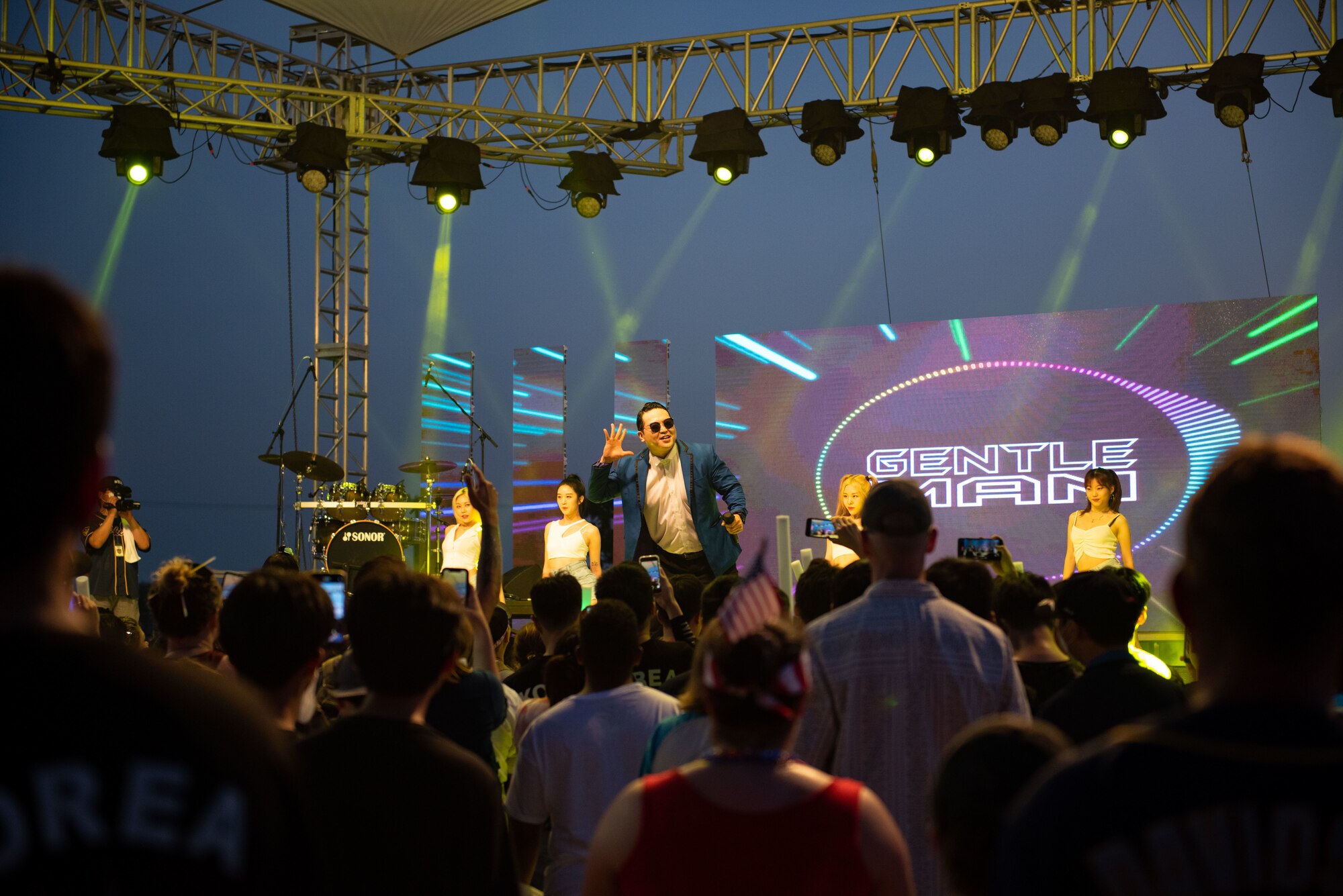 A “Psy Tribute” performer sings during Liberty Fest at Osan Air Base, Republic of Korea, July 2, 2022.