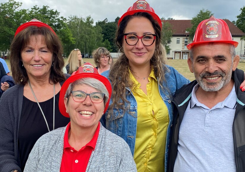 Employees from Logistics Readiness Center Rheinland-Pfalz happily model their fire hats at the LRC Rheinland-Pfalz employee appreciation day, safety stand down day and employee recognition and team building day on Daenner Kaserne in Kaiserslautern, Germany, July 1. Several dozen LRC Rheinland-Pfalz employees from Kaiserslautern and Baumholder took part in the day-long event.