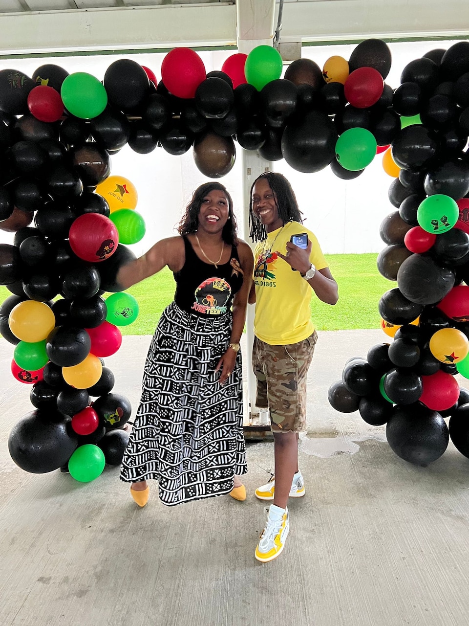 Chief Legalman Kezzi Colvin and Chief Cryptologic Technician (Maintenance) Asia White pose for a photo during a Juneteenth celebration.