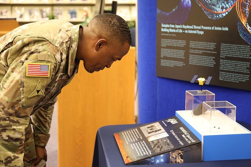 A soldier looks at a display.