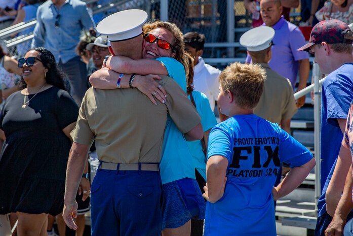 A new U.S. Marine with Lima Company, 3rd Recruit Training Battalion, is greeted by a loved one