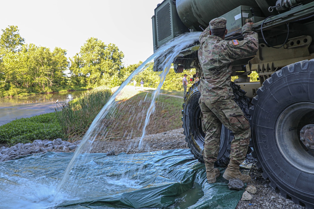 Soldiers from within the 149th Maneuver Enhancement Brigade began transporting water from the Trade Water River to Old City Lake, near Marion. Army Palletized Load System (PLS) vehicles transported non-potable storage tanks daily with the goal of moving up to 80,000 gallons of water to the reservoir to minimize decreasing lake concerns. In addition, bottled water was also distributed at the Old Marion Armory to town residents.