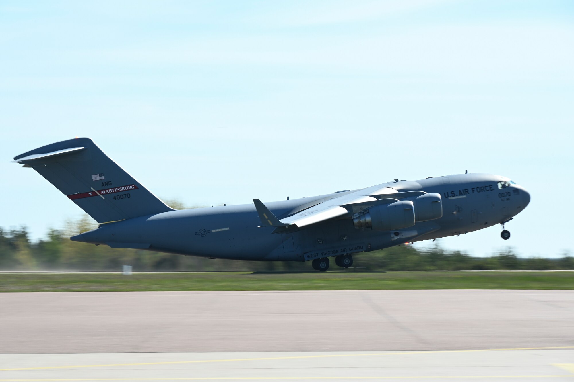 A C-17 Globemaster III aircraft assigned to the 167th Airlift Wing, West Virginia Air National Guard, takes off from Kuressaare Airport, carrying cargo and passengers supporting the Defender 22 exercise, May 23, 2022, in Saaremaa, Estonia.