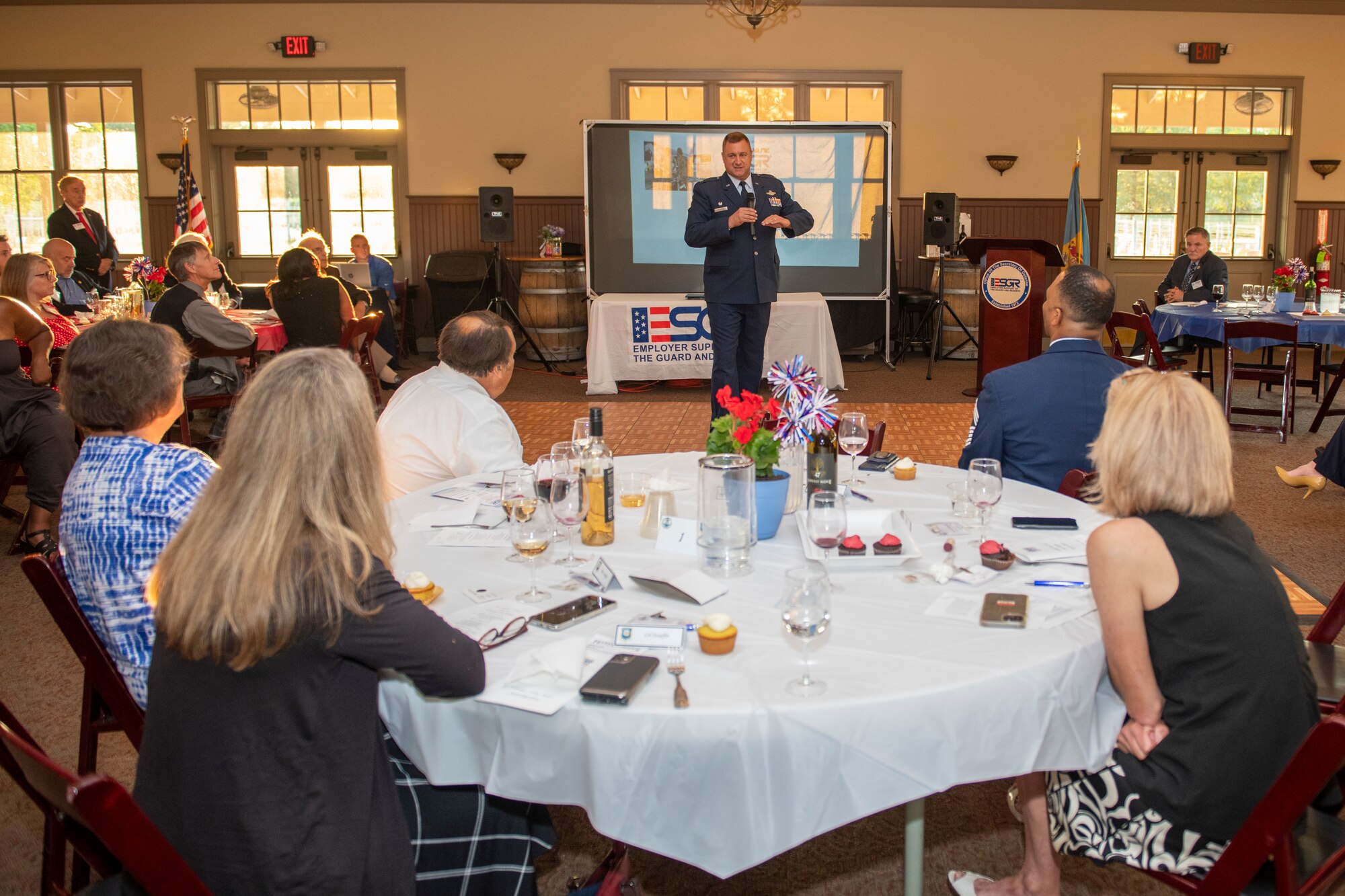 U.S. Air Force Col. Douglas Stouffer, 512th Airlift Wing commander, addresses attendees at the Employer Support of the Guard and Reserve 50th Anniversary Dinner at the Harvest Ridge Winery in Marydel, Delaware, June 29, 2022. Stouffer spoke on the importance of the ESGR and its employer programs and resources. The ESGR offers employer programs and provides insight into the duties of Reservists and Guardsmen across all branches of the military. (U.S. Air Force photo by Senior Airman Ruben Rios)