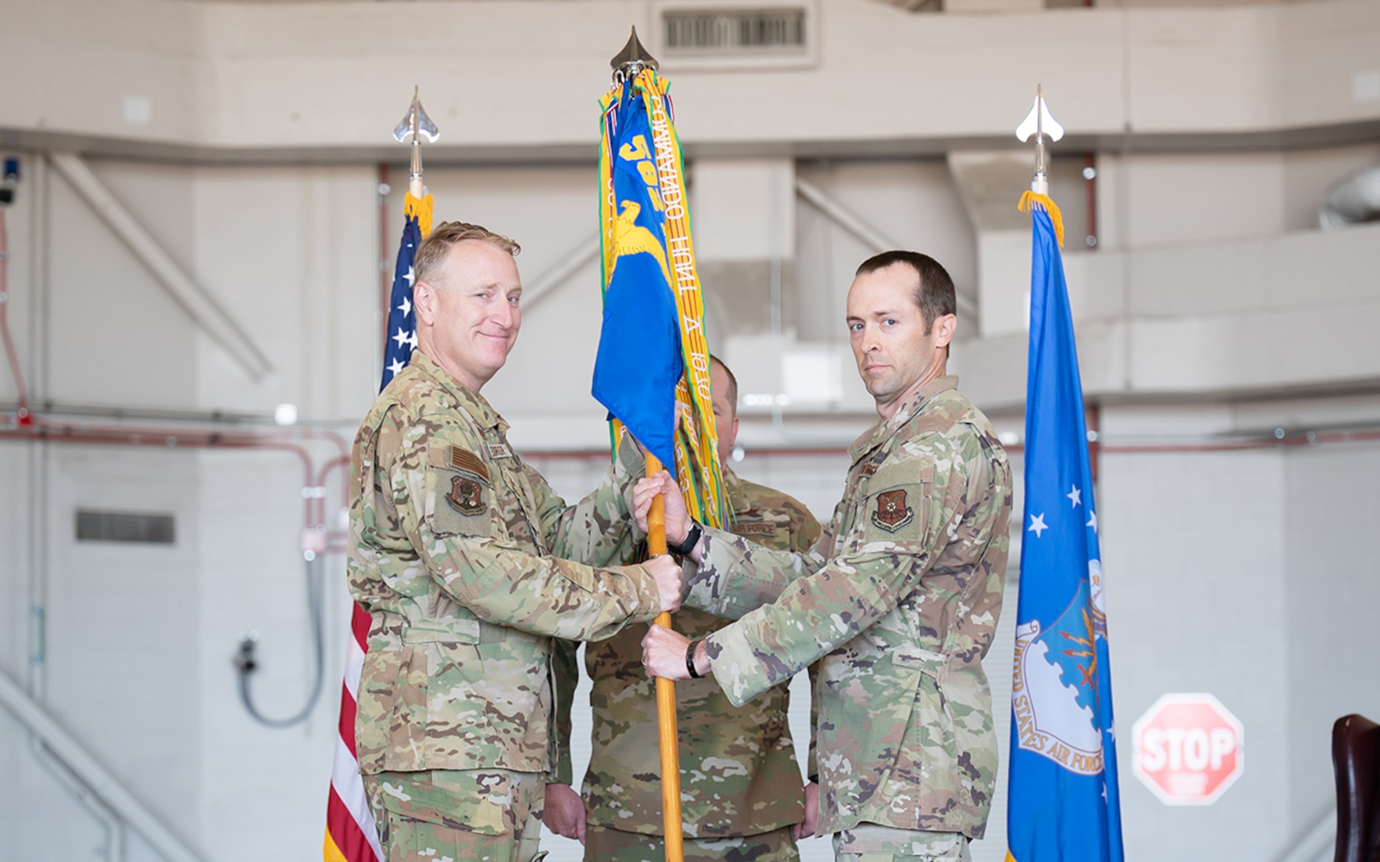 Lt. Col. Kenneth Green, right, accepts command of the 40th Helicopter Squadron from Col. John Beurer, left, 582nd Helicopter Group commander, during a change of command ceremony June 30, 2022, at Malmstrom Air Force Base, Mont.