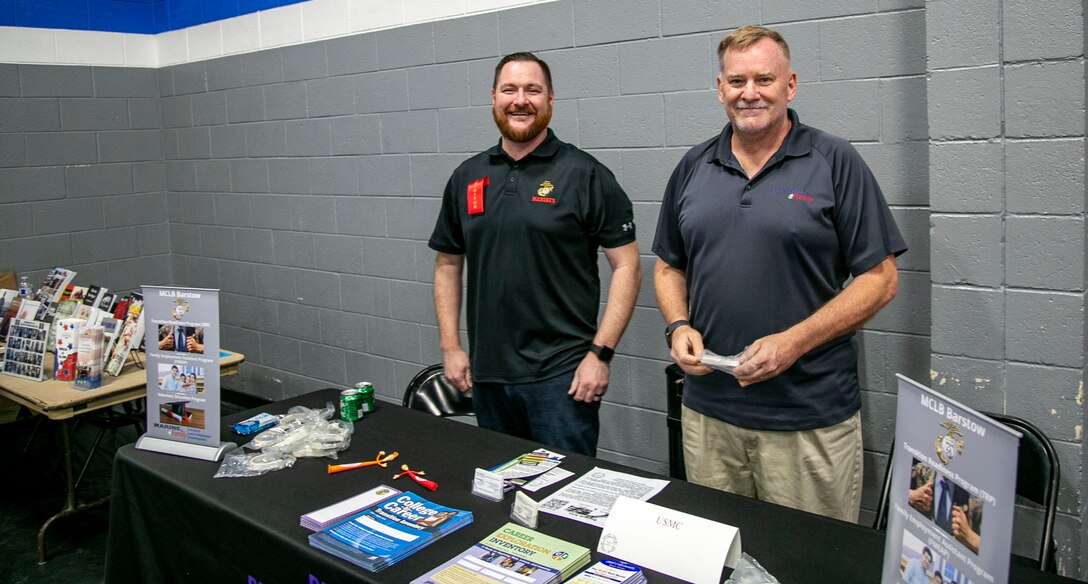 Robert Harris, Marine and Family Programs Manager, and Patrick Rewerts, Career Resource Program Manager, are ready to provide information to interested parties during the Barstow Career Resource Fair and Veterans Connection, held June 30, 2022.