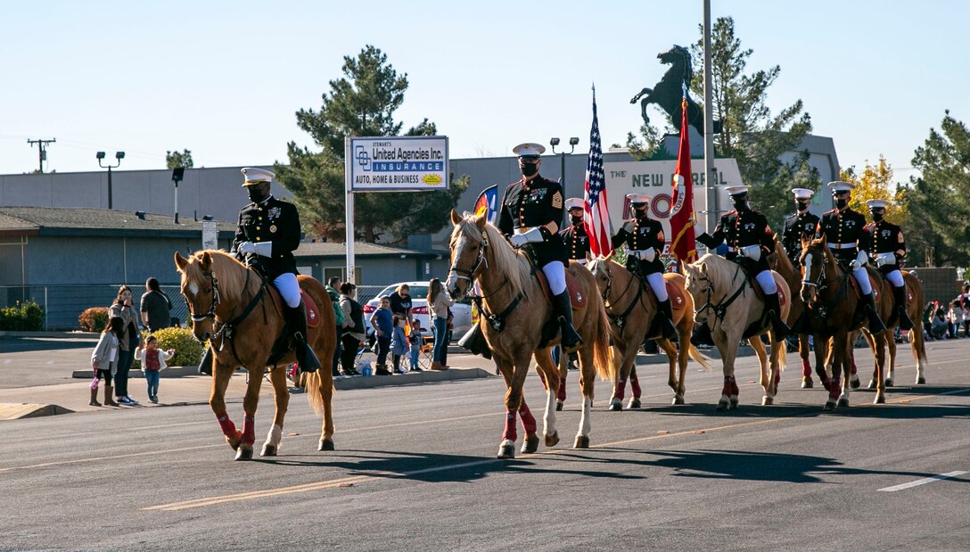 The Marine Corps Mounted Color Guard, led by Col. Gregory Pace, commanding officer of MCLB Barstow, and Sgt. Maj. Edward Kretschmer, base sergeant major,  takes the lead during the 7th annual Victorville Christmas Parade, Dec. 7, 2021.