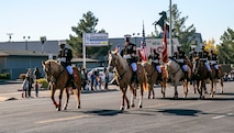 The Marine Corps Mounted Color Guard, led by Col. Gregory Pace, commanding officer of MCLB Barstow, and Sgt. Maj. Edward Kretschmer, base sergeant major,  takes the lead during the 7th annual Victorville Christmas Parade, Dec. 7, 2021.