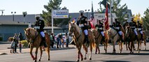 The Marine Corps Mounted Color Guard, led by Col. Gregory Pace, commanding officer of MCLB Barstow, and Sgt. Maj. Edward Kretschmer, base sergeant major,  takes the lead of the 7th annual Victorville Christmas Parade, Dec. 7, 2021.