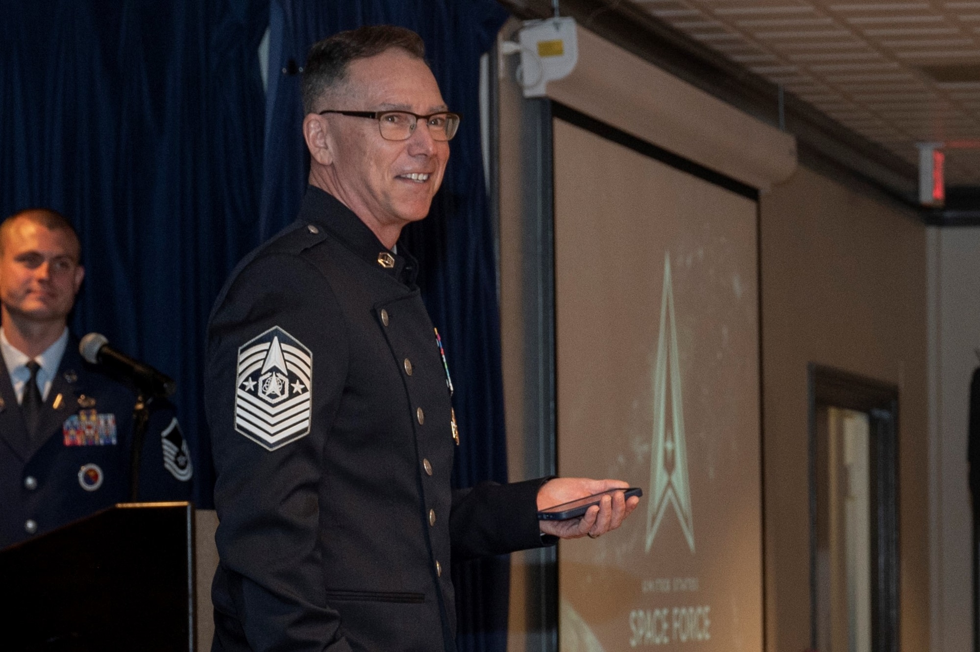 PETERSON SPACE FORCE BASE, Colo. – Chief Master Sgt. of the Space Force Roger A. Towberman, addresses the audience during the first-ever all Space Force SNCO graduation at the Vosler NCO Academy on Peterson Space Force Base, Colorado, June 30, 2022. Towberman stressed the importance of having respect for success and encouraged the audience to applaud each person in recognition of their hard work and achievements. (U.S. Space Force Photo by Airman 1st Class Aaron Edwards)