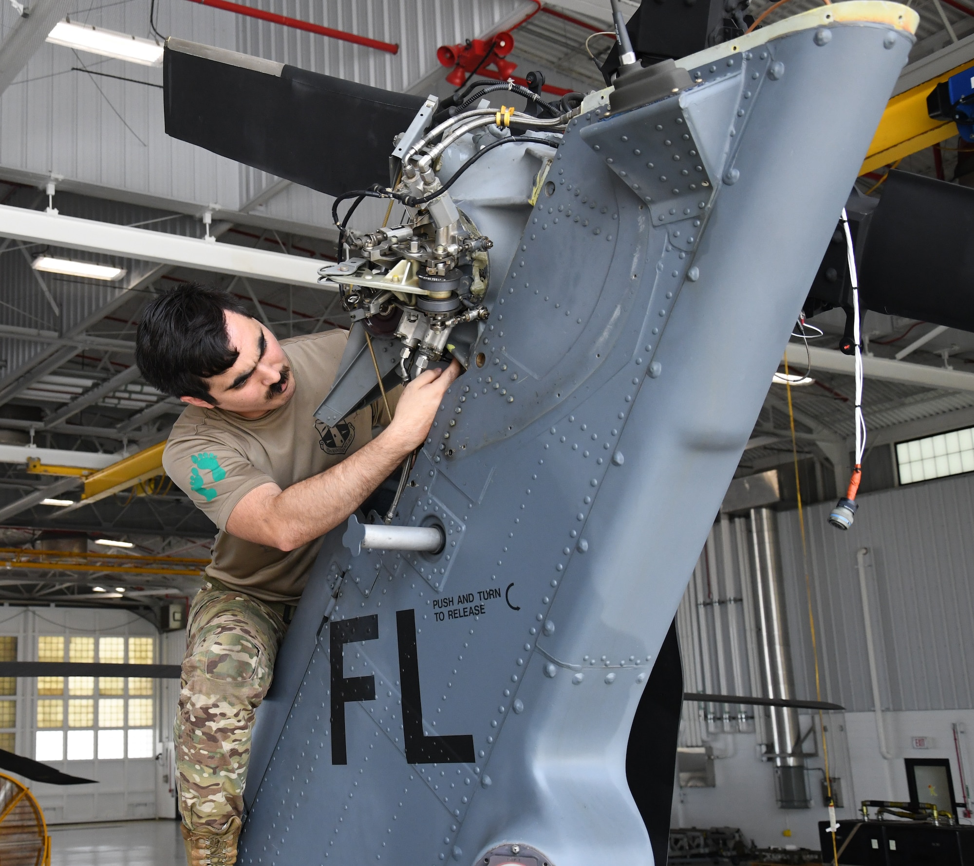 Staff Sgt. Victor DiTanna, 920th Maintenance Squadron maintainer, prepares the tail section for a drive shaft replacement on a HH-60G Pave Hawk at Patrick Space Force Base, Florida, June 30, 2022. The 920th MXS preforms phase inspections to ensure the HH-60G Pave Hawks preform safely and effectively. (U.S. Air Force photo by Staff Sgt. Darius Sostre-Miroir)