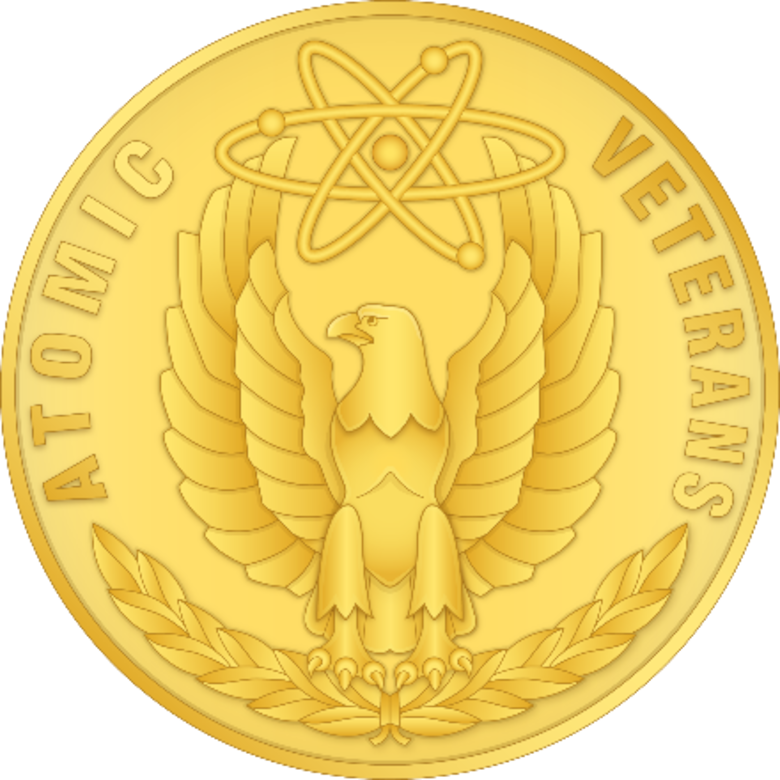 Reverse side of a gold circular medal.