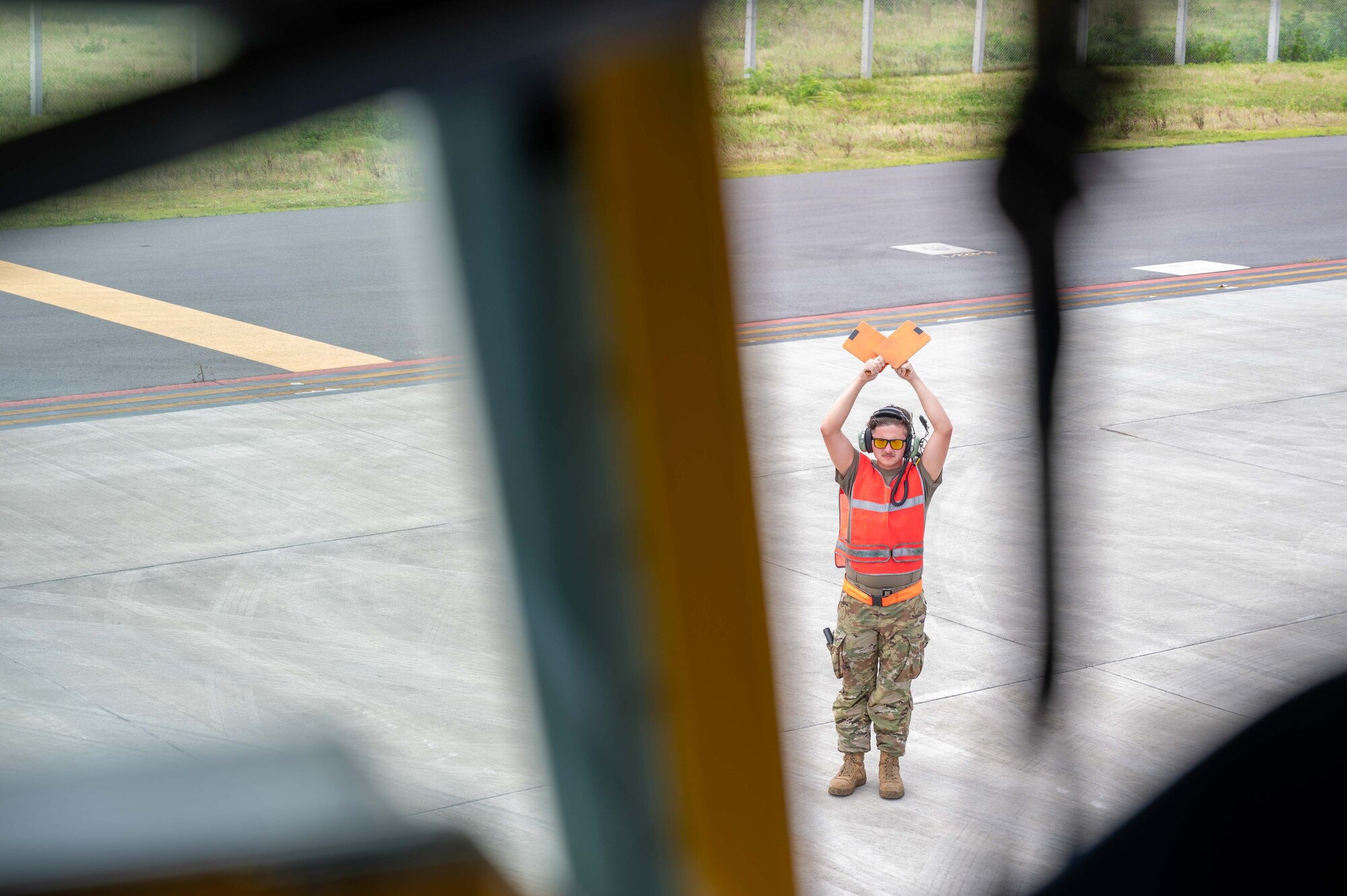 Airman marshals in an aircraft to receive fuel