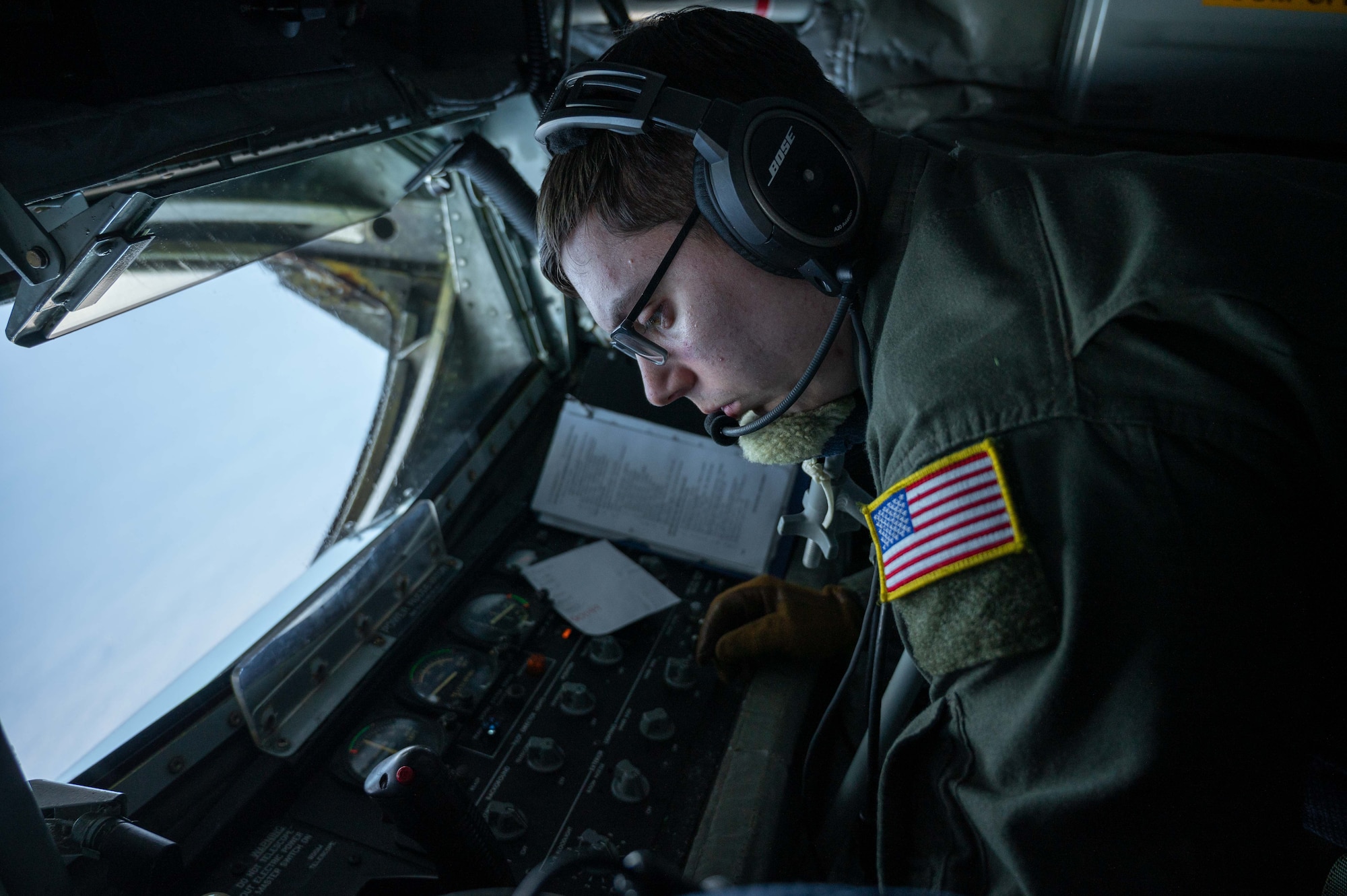 Airman prepares to in-flight refuel aircraft