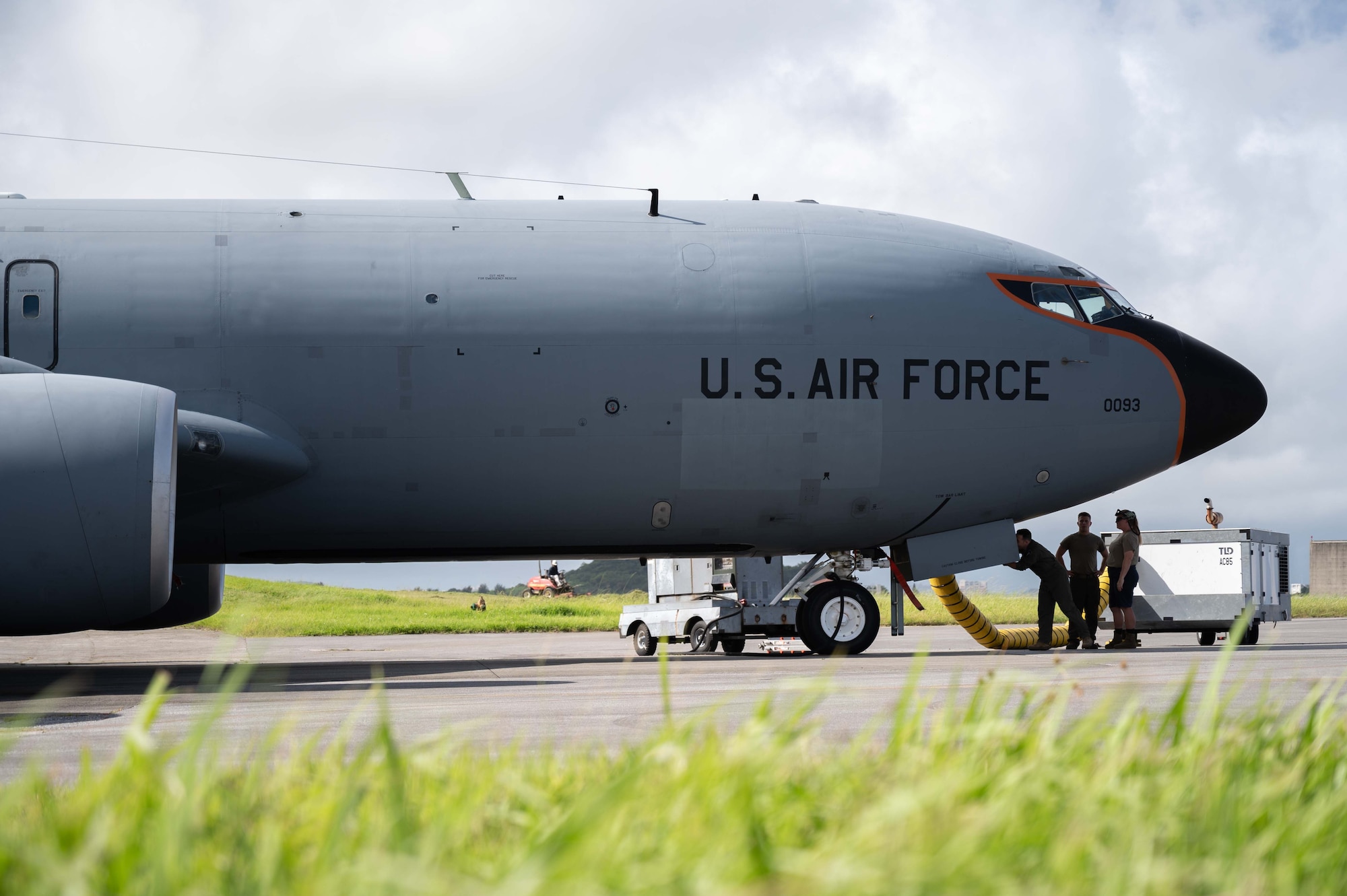 Aircrew and maintainers perform a preflight check on an aircraft