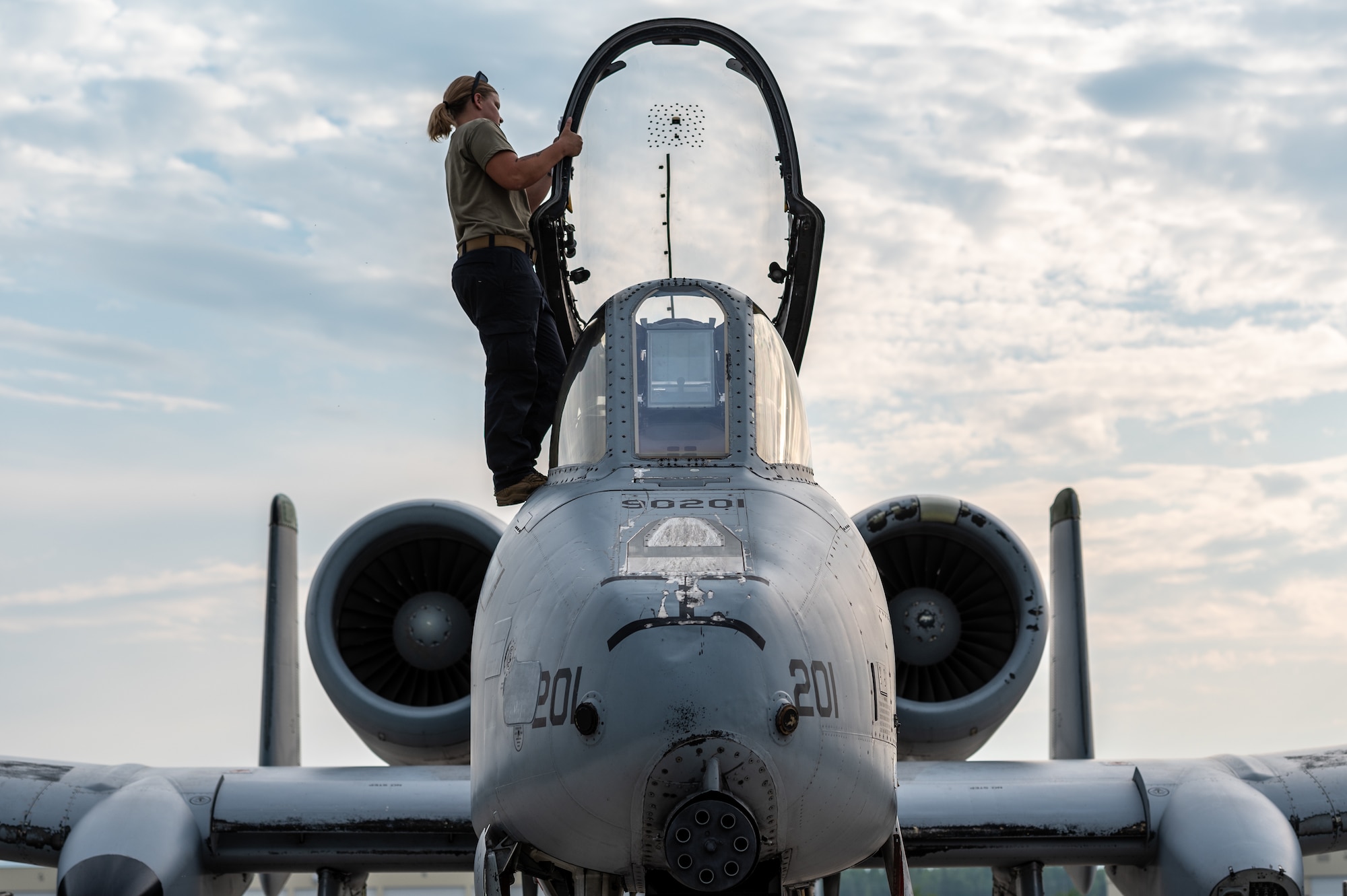 Senior Airman Kelsey White, 25th Fighter Generation Squadron crew chief, prepares the canopy of an A-10 Thunderbolt II for flight operations as part of exercise RED FLAG-Alaska 22-2