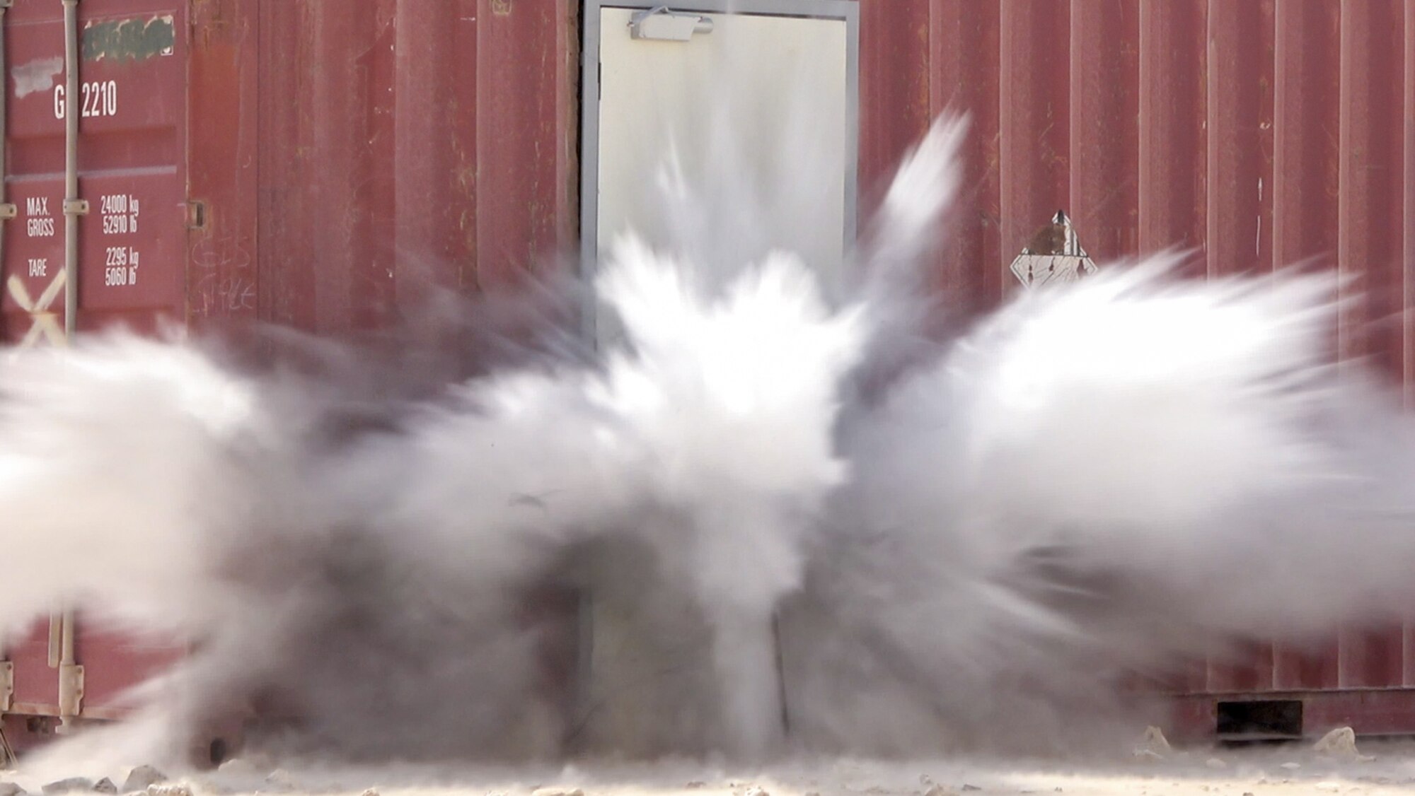 Explosives are detonated on a decoy doorframe as part of a training on Al Udeid Air Base, Qatar, July 1, 2022. Safety is always paramount when handling explosive ordinance. (U.S. Air National Guard photo by Airman 1st Class Constantine Bambakidis)