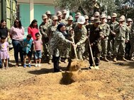 (June 7, 2022) Left to right, School Director Amel Glai, U.S. Navy Lt. j.g. Ramses Carranza, and Tunisian Navy CAPT Naimi Hassen, break ground during a ceremony to mark the start of the construction of a new 130 square meter, two-room kindergarten building with a bathroom at the local elementary school in Bizerte, Tunisia on June 7, 2022. Phoenix Express 22, conducted by U.S. Naval Forces Africa, is a maritime exercise designed to improve cooperation among participating nations in order to increase maritime safety and security in the Mediterranean.