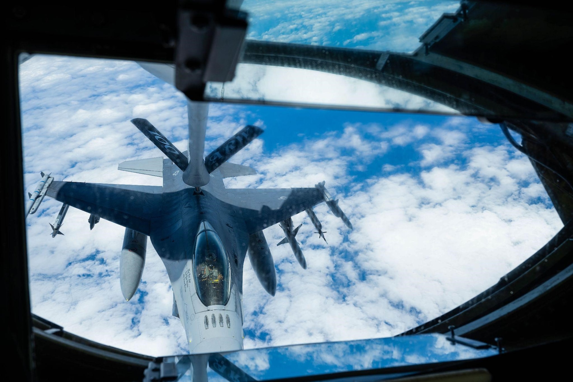 A U.S. Air Force F-16 Fighting Falcon aircraft assigned to the 480th Fighter Squadron, Spangdahlem Air Base, Germany, refuels from the boom pole of a KC-135 Stratotanker aircraft from the 100th Air Refueling Wing, Royal Air Force Mildenhall, England, during Real Thaw 22, June 29, 2022. Real Thaw 22 is an annual multi-national training exercise held by the Portuguese air force who invited the participating nations to attend. (U.S. Air Force photo by Senior Airman Nicholas Swift)