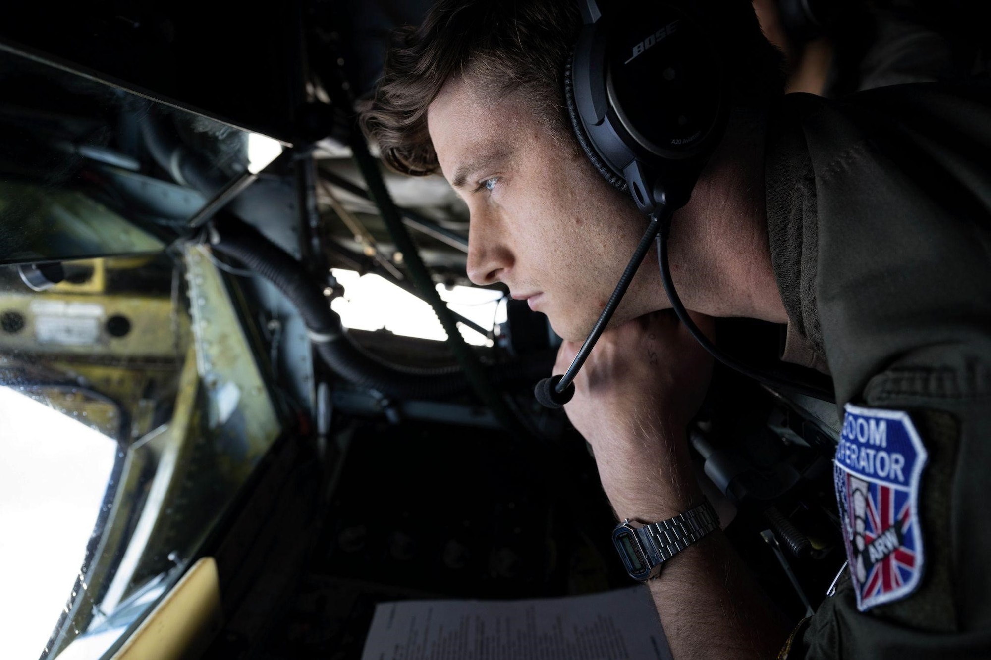 U.S. Air Force Staff Sergeant Brendan Smith, 351st Air Refueling Squadron Boom Operator, searches the skies above Spain for an approaching F-16 Fighting Falcon aircraft ready to be refueled by a KC-135 Stratotanker aircraft assigned to Royal Air Force Mildenhall, England, during Real Thaw 22, June 28, 2022. Real Thaw 22 is an annual multi-national training exercise held by the Portuguese air force that ensures U.S., NATO, and Portuguese armed forces are prepared to defend the skies over western Europe. (U.S. Air Force photo by Senior Airman Nicholas Swift)