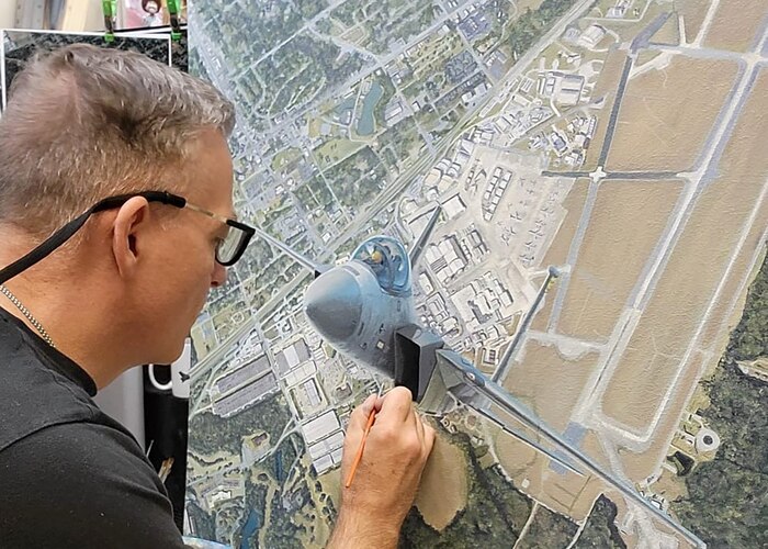 Photo of Darby Perring painting.